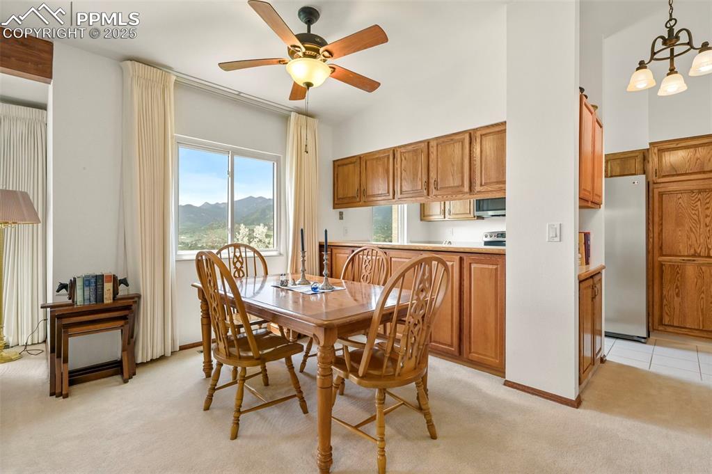 934 Fontmore Road, Unit C Colorado Springs, CO 80904 - Photo 17 of 37 a view of a dining room with furniture window and outside view
