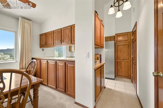 a view of kitchen with furniture and windows