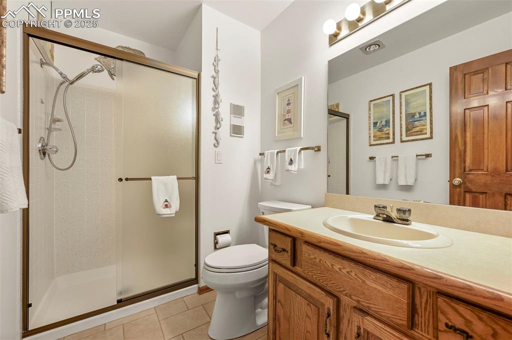 934 Fontmore Road, Unit C Colorado Springs, CO 80904 - Photo 22 of 37 a bathroom with a granite countertop sink toilet and shower