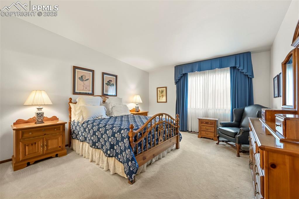 934 Fontmore Road, Unit C Colorado Springs, CO 80904 - Photo 23 of 37 a bedroom with a bed and a window