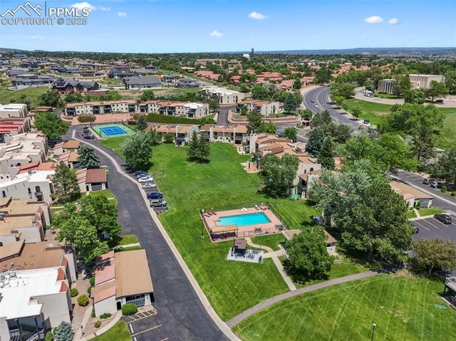 an aerial view of a garden with houses