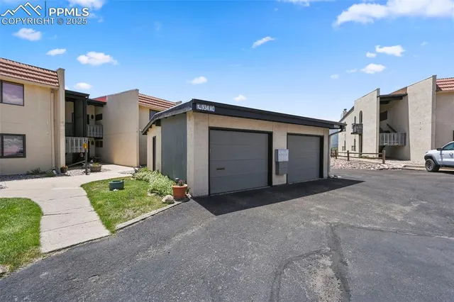 a picture of a bench in front of a white house