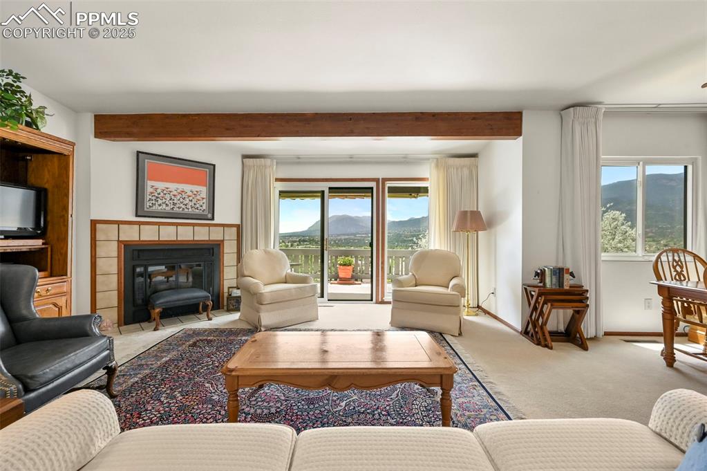 934 Fontmore Road, Unit C Colorado Springs, CO 80904 - Photo 5 of 37 a living room with furniture large window and a fireplace
