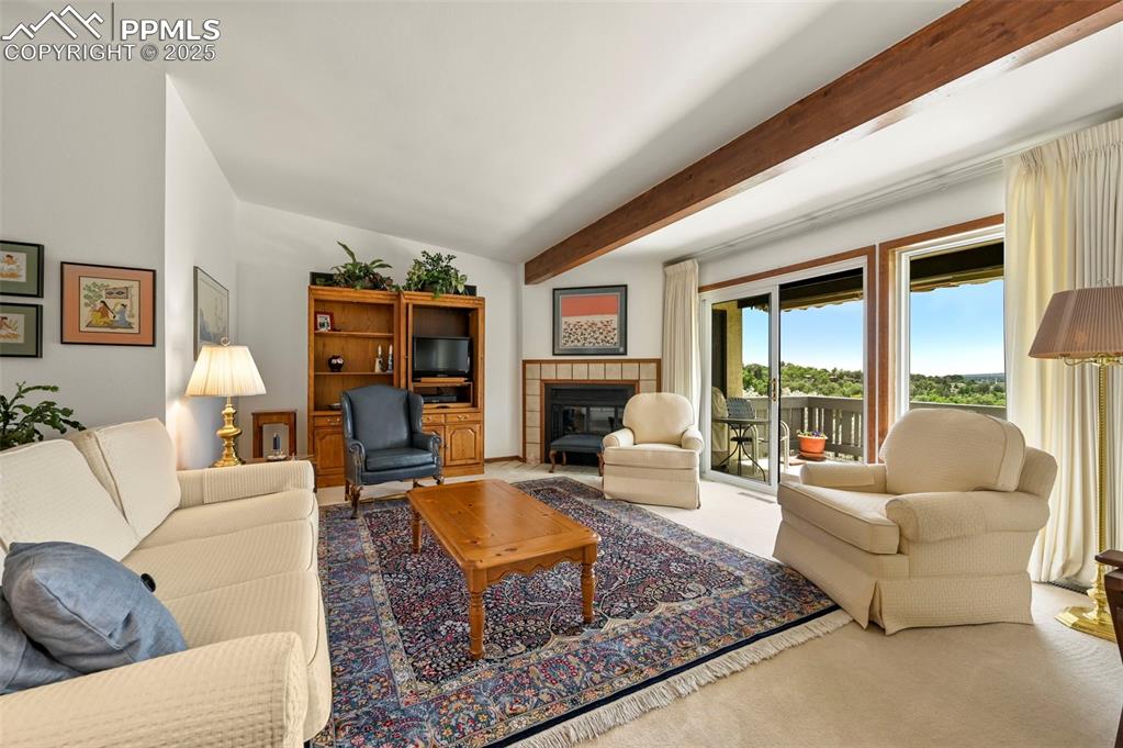 934 Fontmore Road, Unit C Colorado Springs, CO 80904 - Photo 7 of 37 a living room with furniture large window and a fireplace