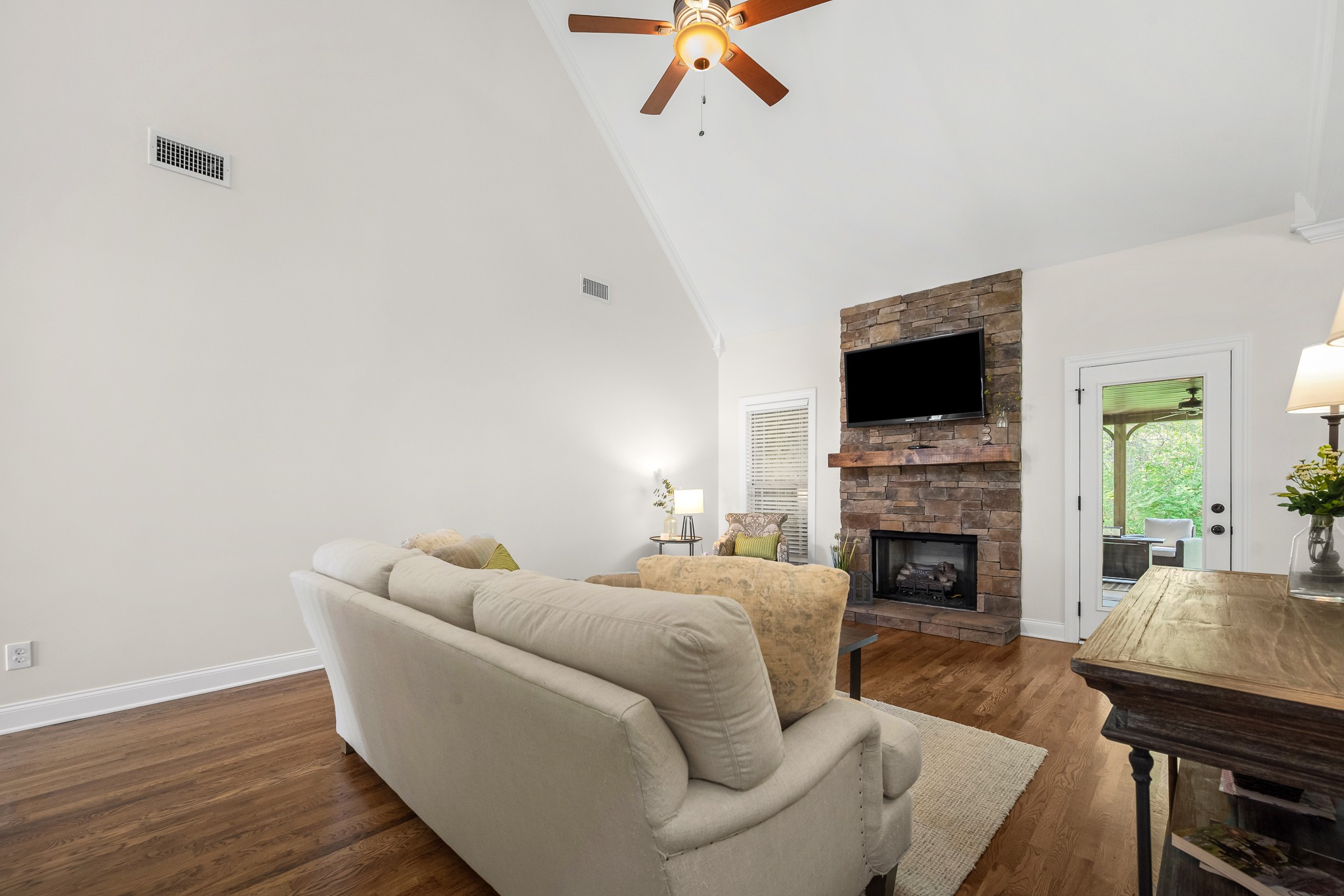 3023 Columnar Court Murfreesboro, TN 37129 - Photo 13 of 55 a living room with furniture a fireplace and a flat screen tv