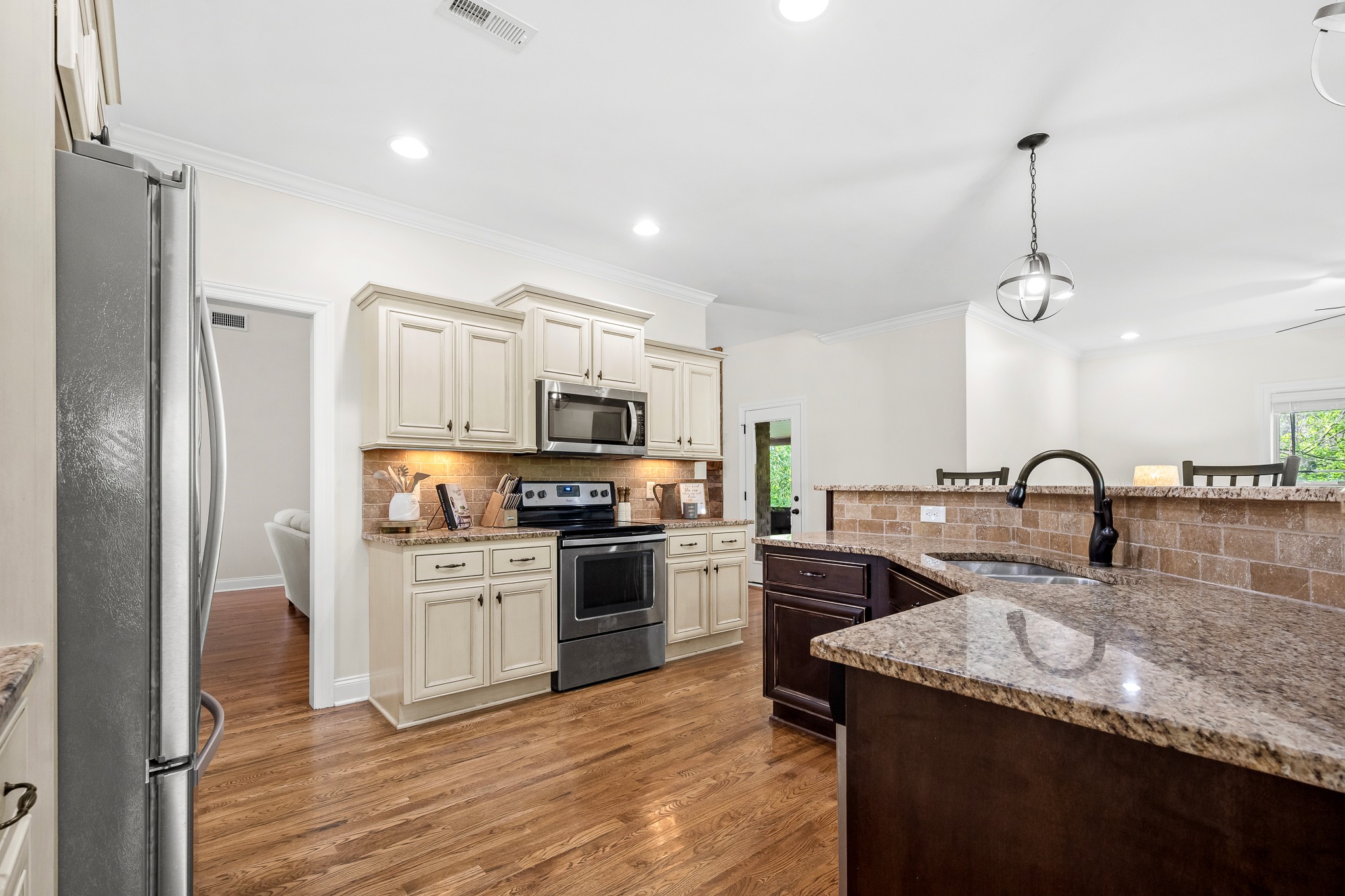 3023 Columnar Court Murfreesboro, TN 37129 - Photo 17 of 55 a kitchen with stainless steel appliances granite countertop a sink stove and refrigerator
