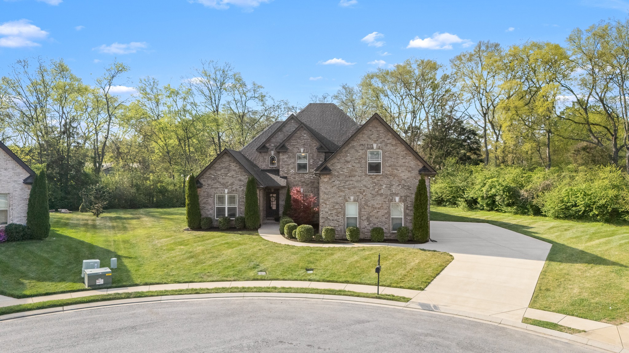 3023 Columnar Court Murfreesboro, TN 37129 - Photo 2 of 55 a view of a big house with a big yard and large trees
