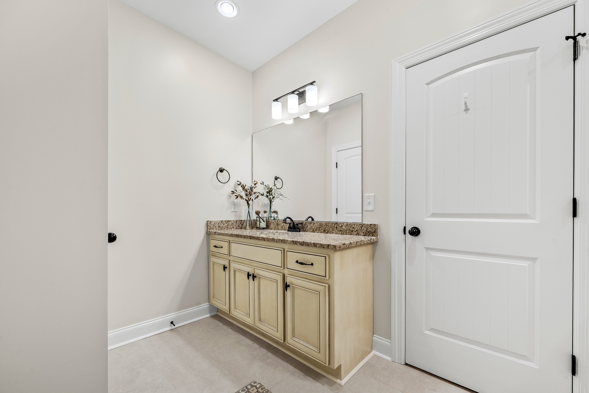 3023 Columnar Court Murfreesboro, TN 37129 - Photo 34 of 55 a bathroom with a granite countertop sink a mirror and a