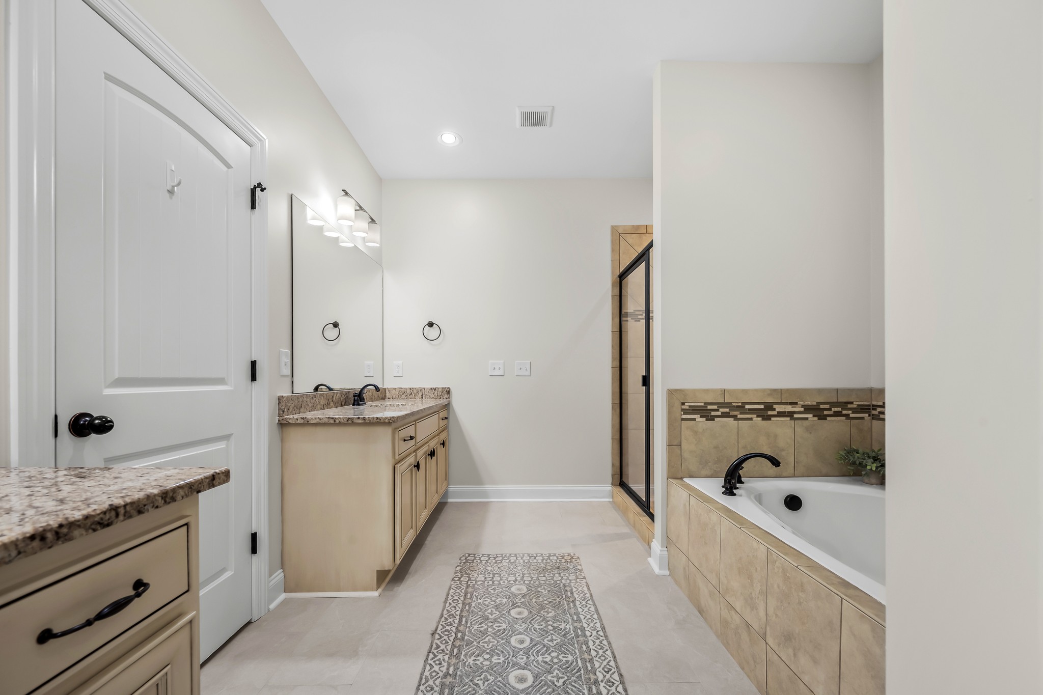 3023 Columnar Court Murfreesboro, TN 37129 - Photo 35 of 55 a bathroom with a tub sink and mirror