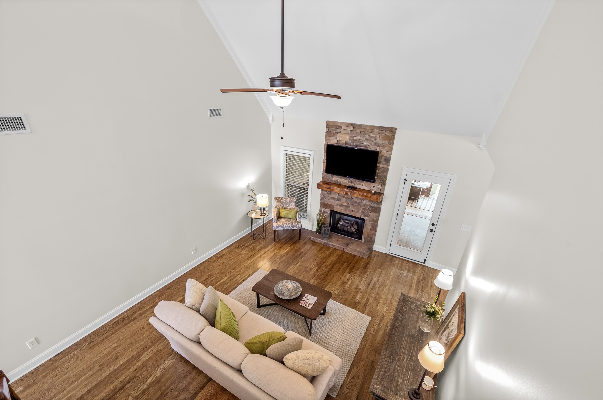 3023 Columnar Court Murfreesboro, TN 37129 - Photo 38 of 55 a living room with furniture a fireplace and a flat screen tv