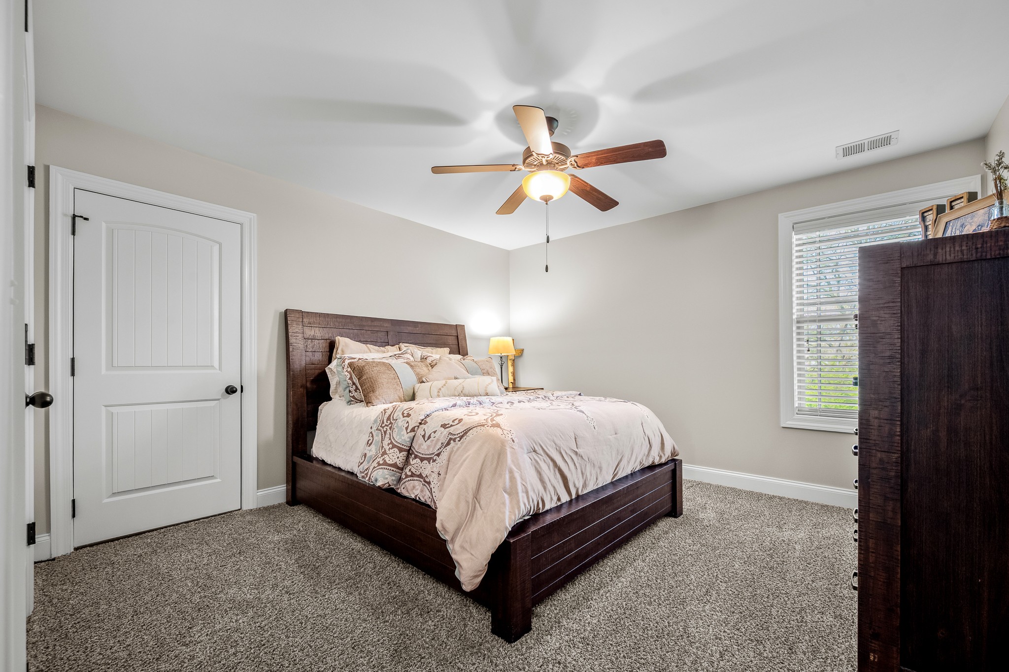 3023 Columnar Court Murfreesboro, TN 37129 - Photo 41 of 55 a bed sitting in a bedroom next to a window and a chandelier