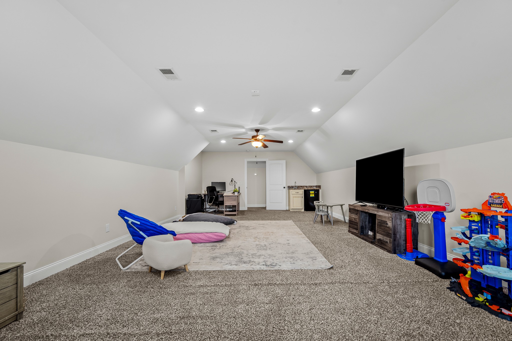 3023 Columnar Court Murfreesboro, TN 37129 - Photo 43 of 55 a living room with furniture a flat screen tv and a chandelier