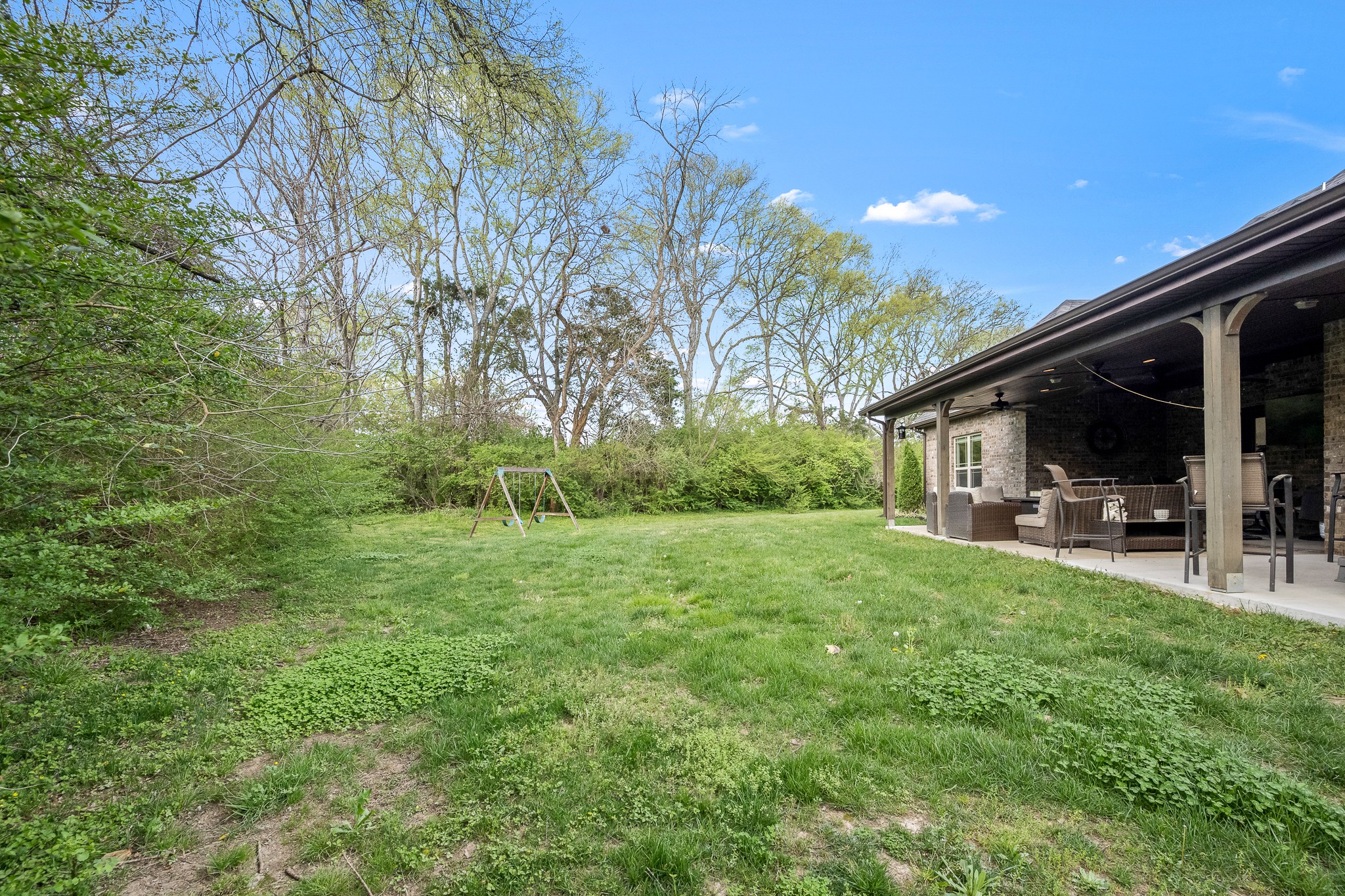 3023 Columnar Court Murfreesboro, TN 37129 - Photo 49 of 55 a view of backyard with table and chairs a barbeque and a large trees