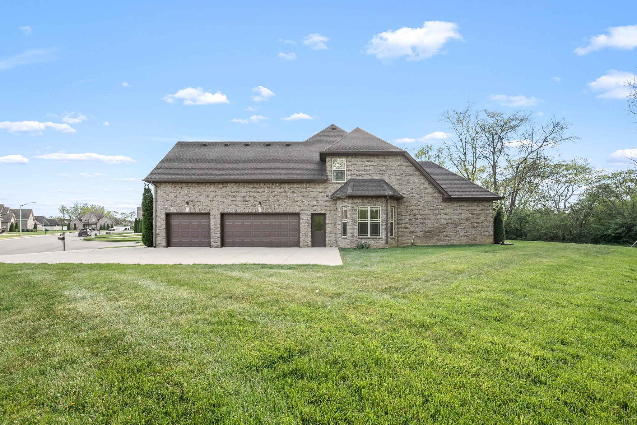 3023 Columnar Court Murfreesboro, TN 37129 - Photo 5 of 55 a front view of a house with a garden and yard