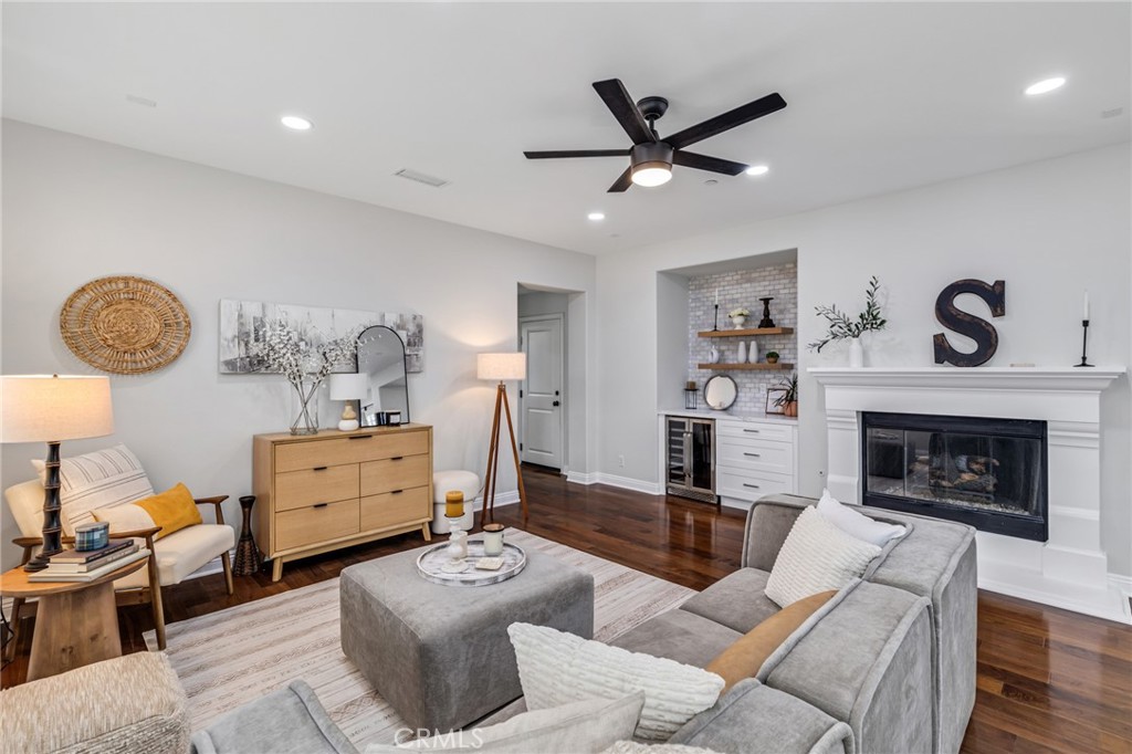 12 John Street Ladera Ranch, CA 92694 - Photo 14 of 37 a living room with furniture and a fireplace