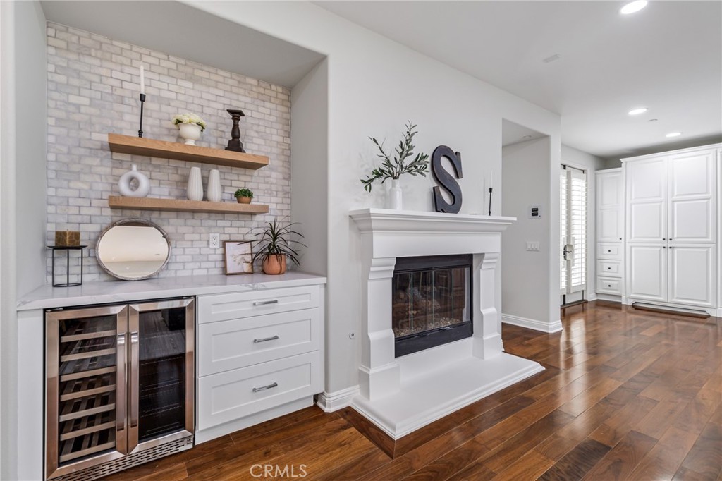 12 John Street Ladera Ranch, CA 92694 - Photo 15 of 37 a living room with furniture and a fireplace
