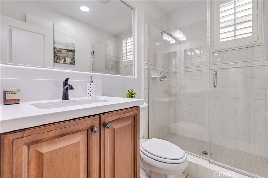 12 John Street Ladera Ranch, CA 92694 - Photo 17 of 37 a bathroom with a sink a toilet and shower