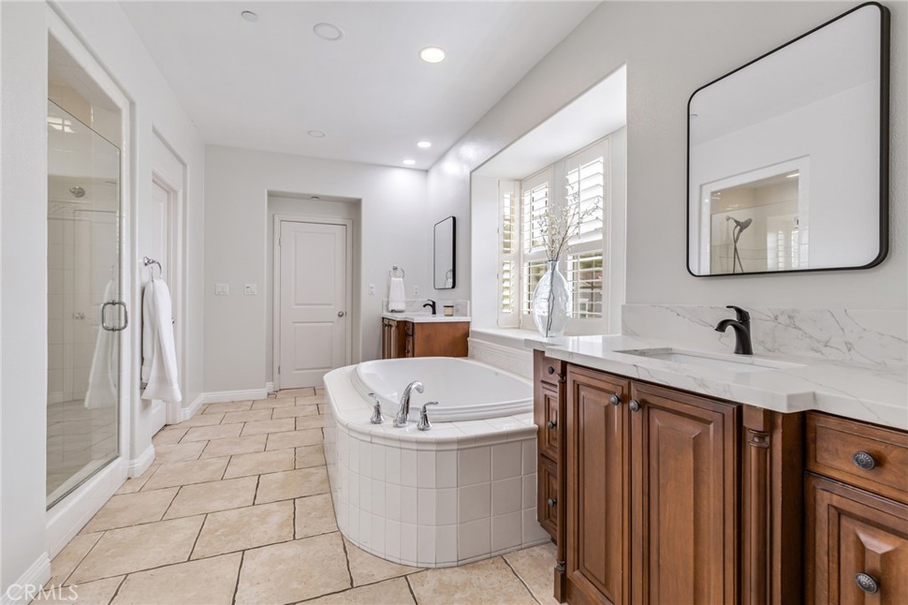 12 John Street Ladera Ranch, CA 92694 - Photo 20 of 37 a bathroom with a sink a toilet and shower