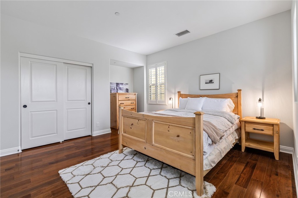 12 John Street Ladera Ranch, CA 92694 - Photo 25 of 37 a bedroom with a bed and a dresser