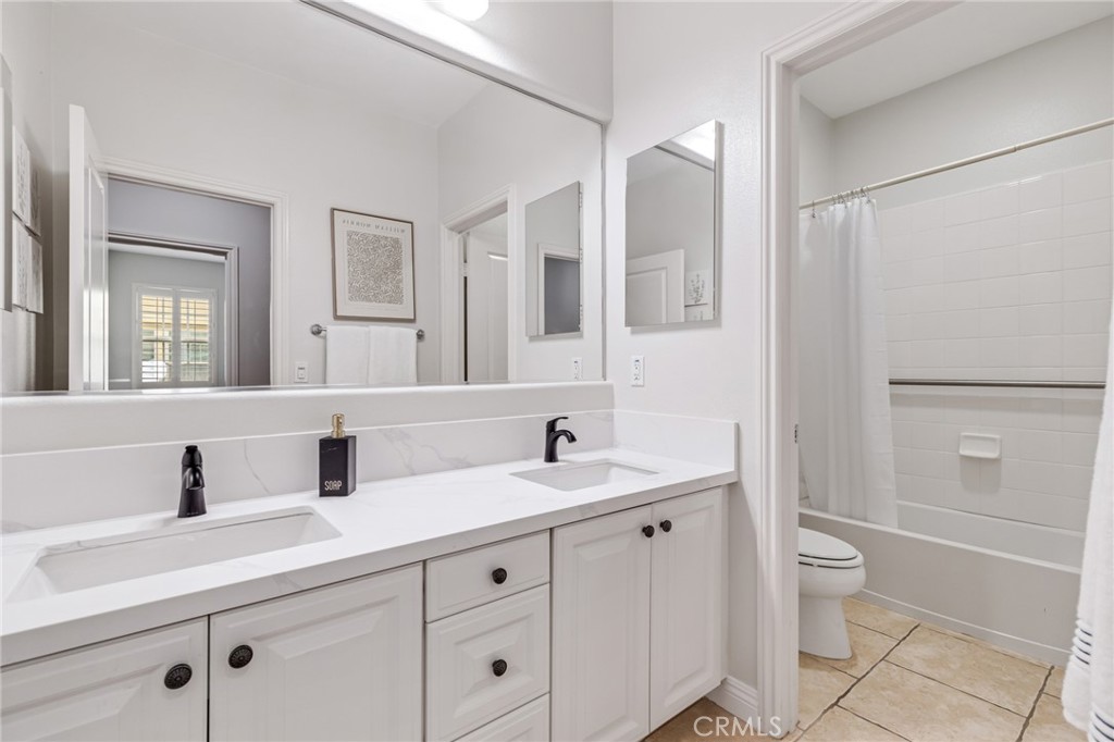 12 John Street Ladera Ranch, CA 92694 - Photo 26 of 37 a bathroom with a double vanity sink mirror and toilet