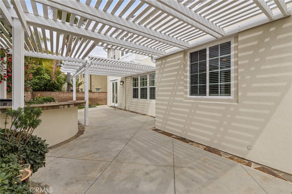 12 John Street Ladera Ranch, CA 92694 - Photo 31 of 37 a view of a patio with table and chairs and potted plants
