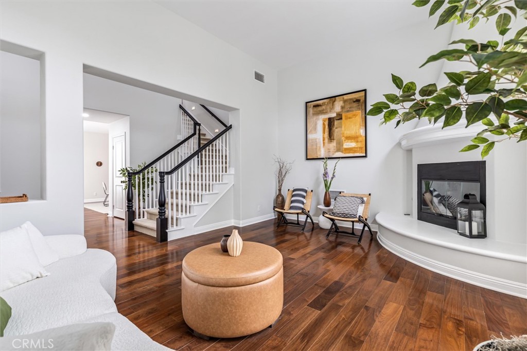 12 John Street Ladera Ranch, CA 92694 - Photo 6 of 37 a living room with furniture and a wooden floor