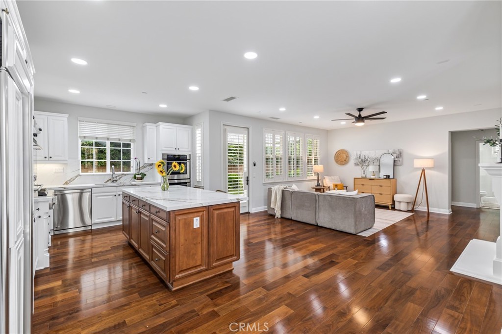 12 John Street Ladera Ranch, CA 92694 - Photo 10 of 37 a living room with furniture and a wooden floor