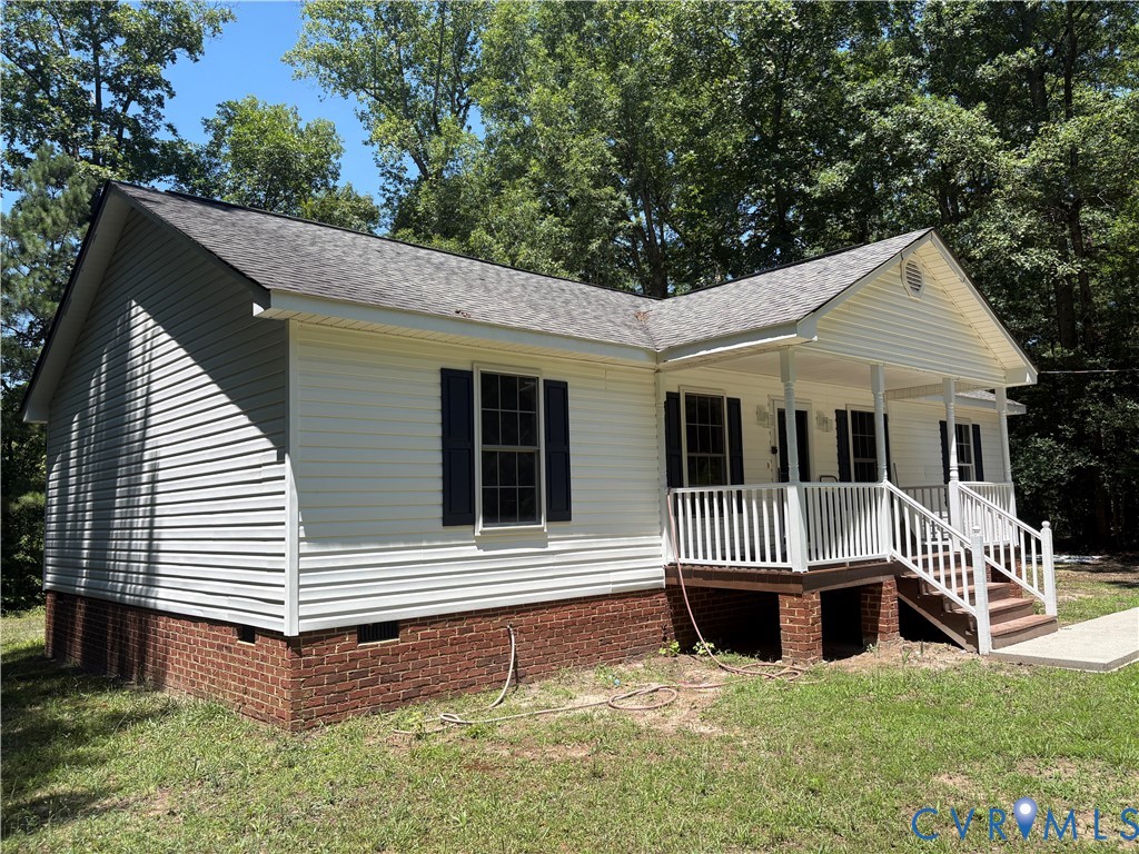 14002 Sunnybrook Road Petersburg, VA 23805 - Photo 18 of 21 White siding exterior with a covered front porch a