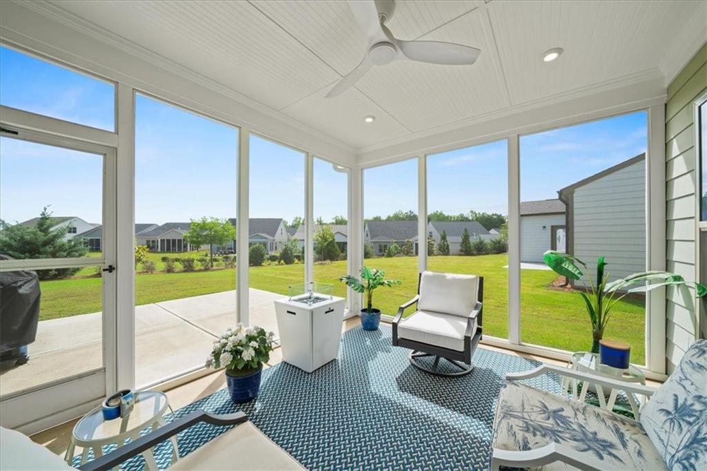 2457 Naples Street Hoschton, GA 30548 - Photo 28 of 41 a living room with furniture and a large window