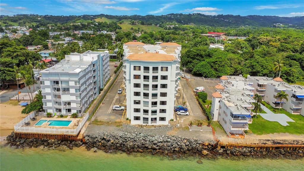 429 Calle Pogio Doleta, Unit 4G Rincon, Rincón 00677 - Photo 1 of 1 an aerial view of multiple house