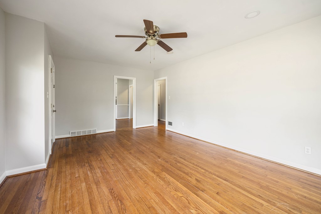 6366 Michael Avenue Columbus, GA 31909 - Photo 11 of 38 a view of empty room with wooden floor and ceiling fan