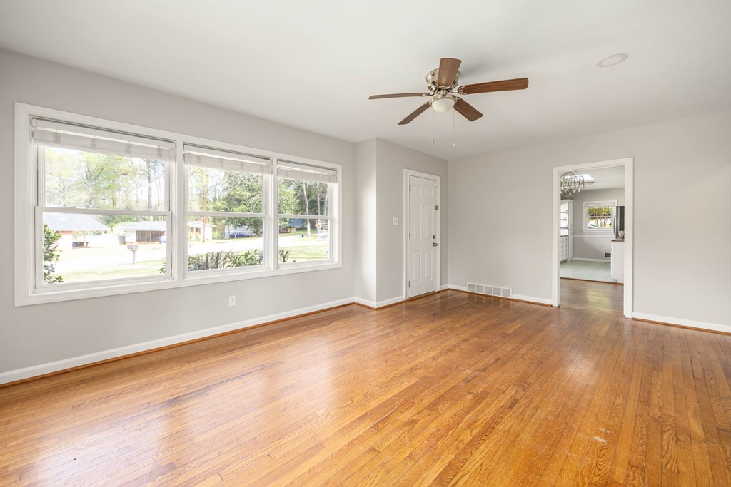 6366 Michael Avenue Columbus, GA 31909 - Photo 12 of 38 a view of empty room with wooden floor and fan