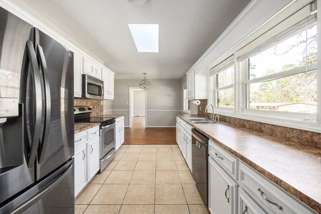 6366 Michael Avenue Columbus, GA 31909 - Photo 14 of 38 a large kitchen with a stove a sink and a refrigerator