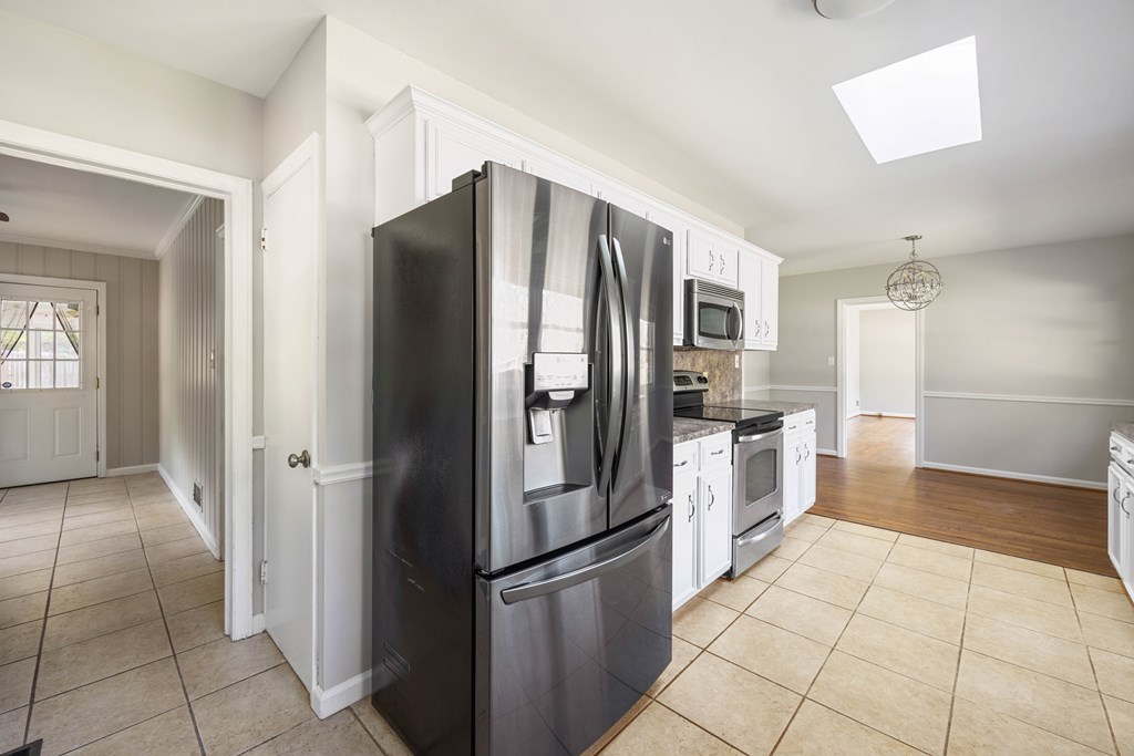 6366 Michael Avenue Columbus, GA 31909 - Photo 15 of 38 a kitchen with stainless steel appliances granite countertop a refrigerator and a sink