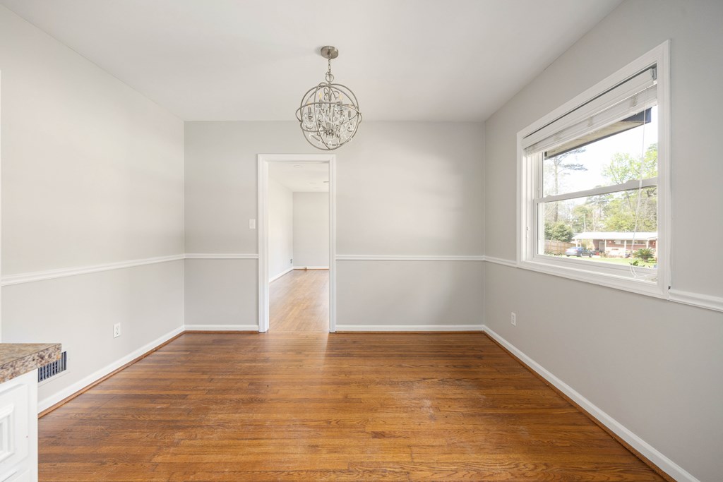 6366 Michael Avenue Columbus, GA 31909 - Photo 18 of 38 a view of empty room with wooden floor and window