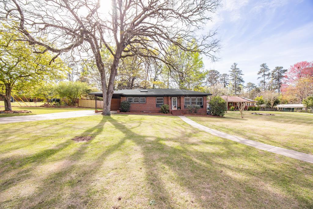 6366 Michael Avenue Columbus, GA 31909 - Photo 2 of 38 a house with trees in front of it