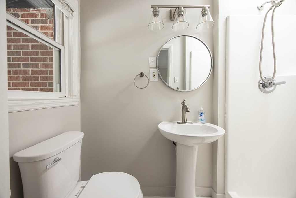 6366 Michael Avenue Columbus, GA 31909 - Photo 22 of 38 a bathroom with a sink a toilet and a mirror
