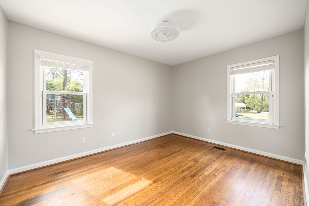 6366 Michael Avenue Columbus, GA 31909 - Photo 24 of 38 a view of an empty room with wooden floor and a window