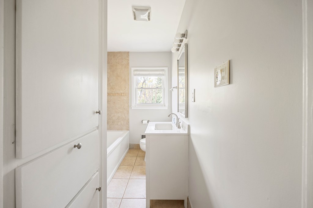 6366 Michael Avenue Columbus, GA 31909 - Photo 25 of 38 a bathroom with a sink a mirror and a bathtub