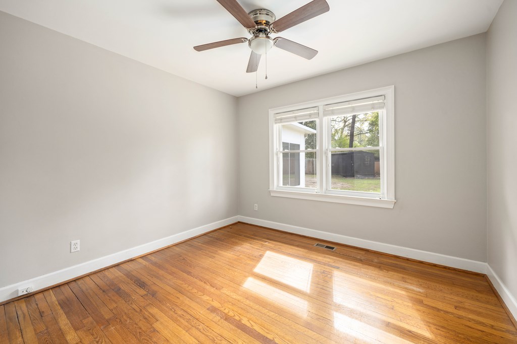 6366 Michael Avenue Columbus, GA 31909 - Photo 26 of 38 an empty room with a window and a ceiling fan