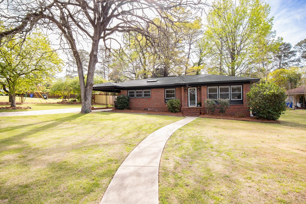 6366 Michael Avenue Columbus, GA 31909 - Photo 3 of 38 a house view with swimming pool in front of house
