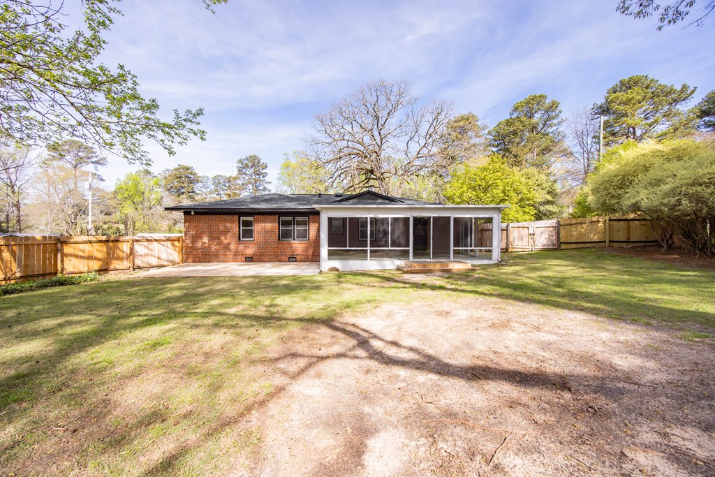 6366 Michael Avenue Columbus, GA 31909 - Photo 34 of 38 a view of a house with a big yard and large trees