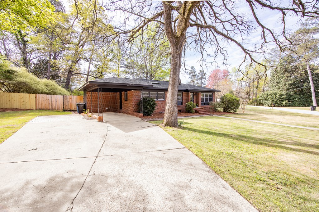 6366 Michael Avenue Columbus, GA 31909 - Photo 4 of 38 a view of a swimming pool with a patio