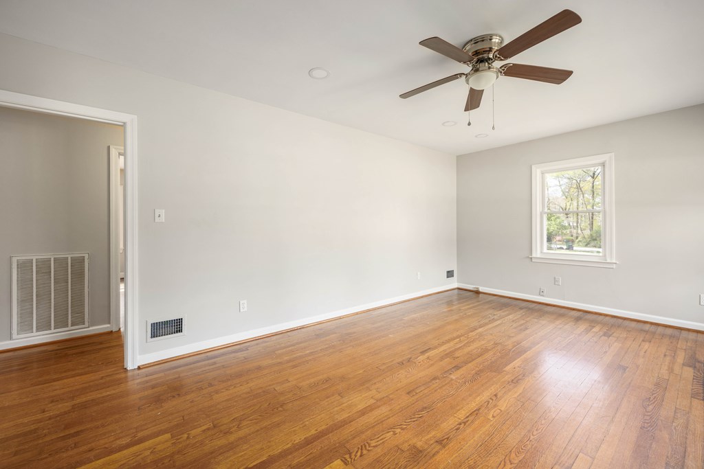 6366 Michael Avenue Columbus, GA 31909 - Photo 8 of 38 an empty room with wooden floor and windows