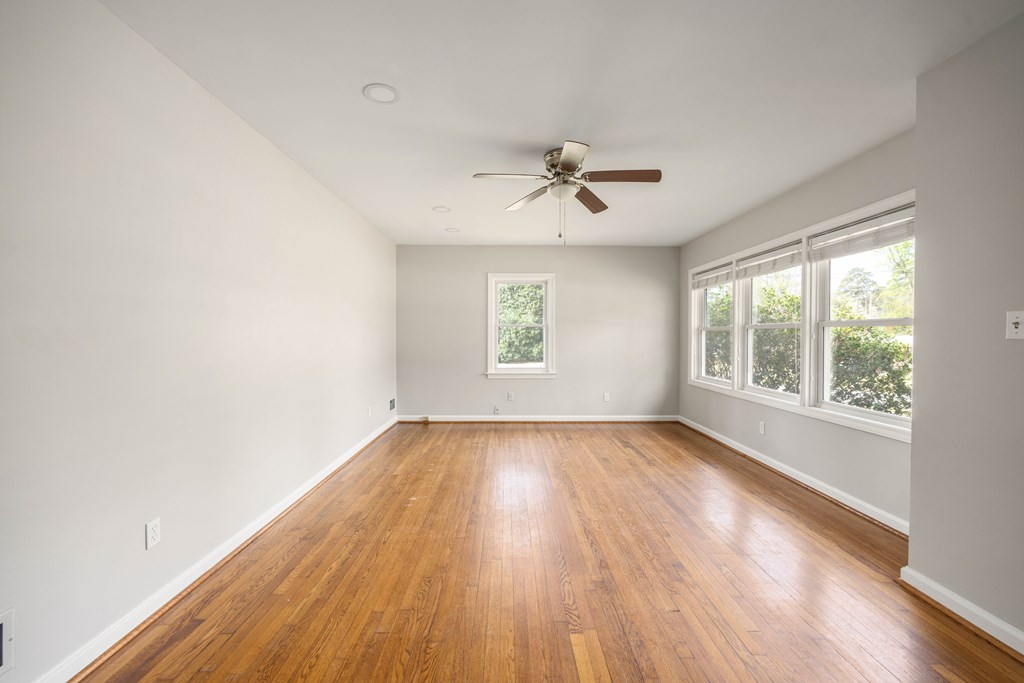 6366 Michael Avenue Columbus, GA 31909 - Photo 9 of 38 a view of empty room with wooden floor and fan