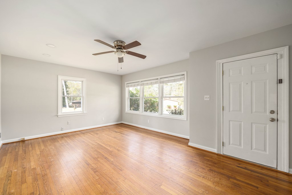 6366 Michael Avenue Columbus, GA 31909 - Photo 10 of 38 a view of an empty room with a window and wooden floor