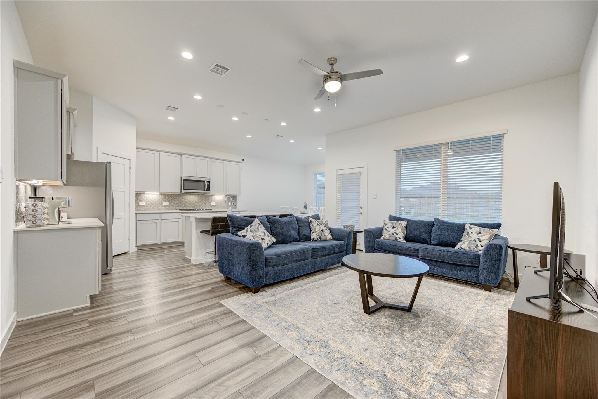 22515 Modica Rift Lane Katy, TX 77449 - Photo 13 of 34 a living room with furniture and a flat screen tv