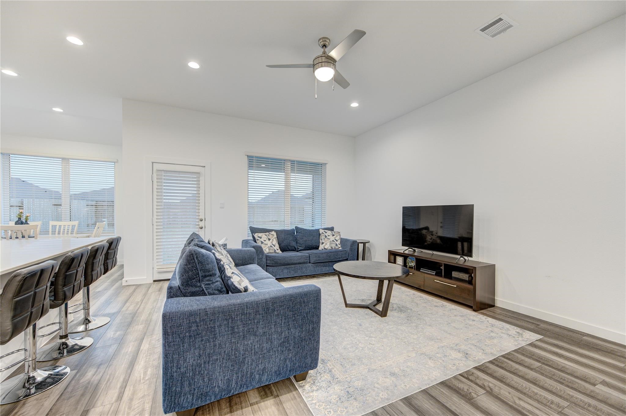 22515 Modica Rift Lane Katy, TX 77449 - Photo 14 of 34 a living room with furniture and a flat screen tv