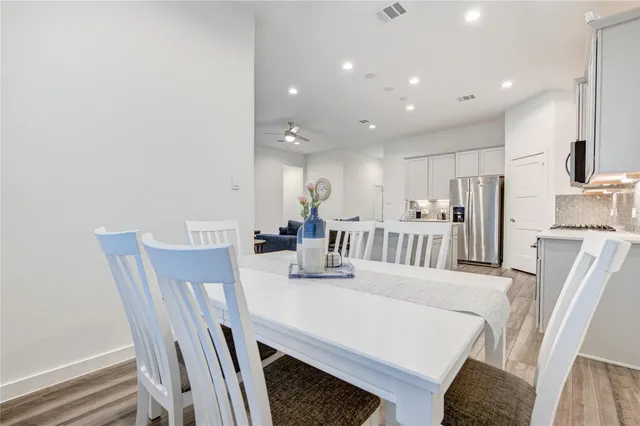 a dining room with furniture and a table