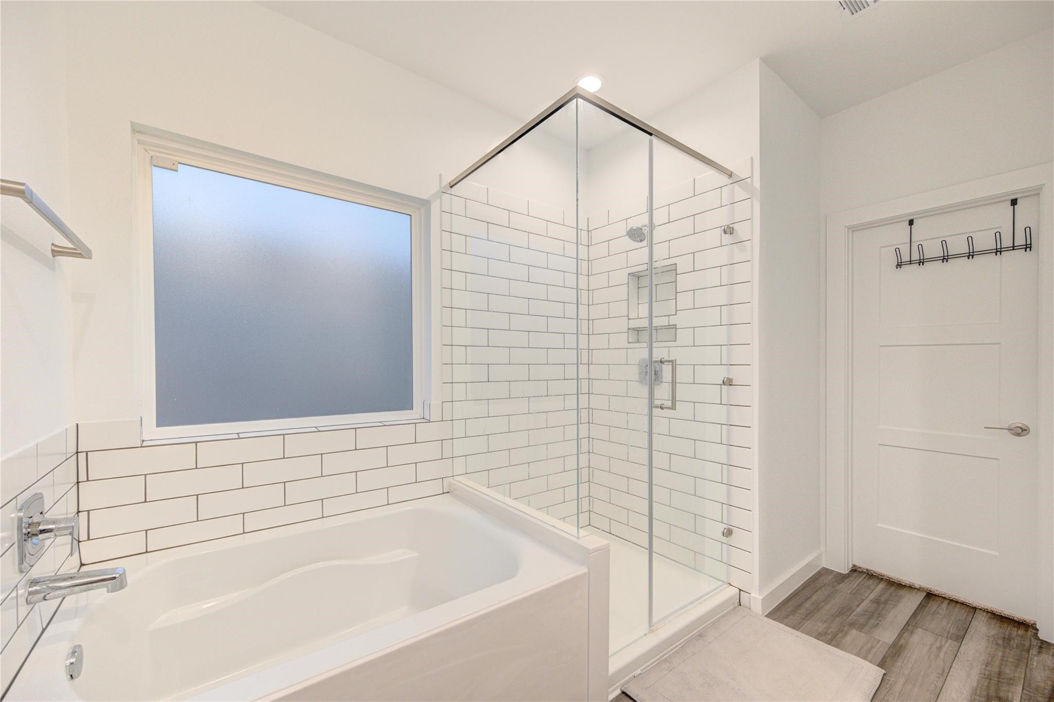 22515 Modica Rift Lane Katy, TX 77449 - Photo 27 of 34 a bathroom with a bathtub and shower